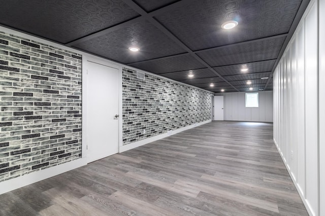 1020 1st St S, Cold Spring, MN 56320 - basement with wood finished floors and brick wall