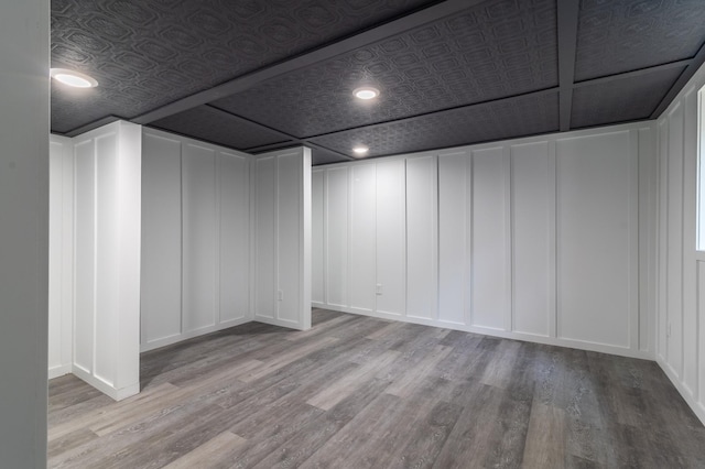 1020 1st St S, Cold Spring, MN 56320 - basement with a decorative wall, wood finished floors, an ornate ceiling, and recessed lighting