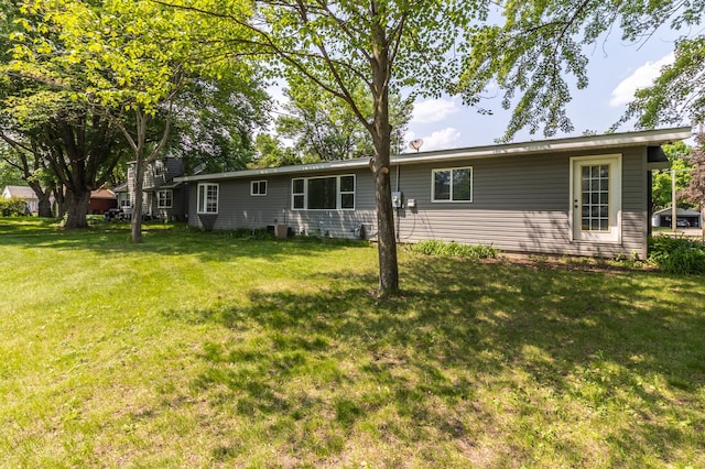 1020 1st St S, Cold Spring, MN 56320 - rear view of property featuring a yard
