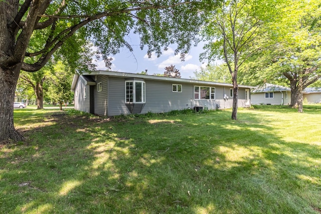 1020 1st St S, Cold Spring, MN 56320 - back of house with a lawn and central AC