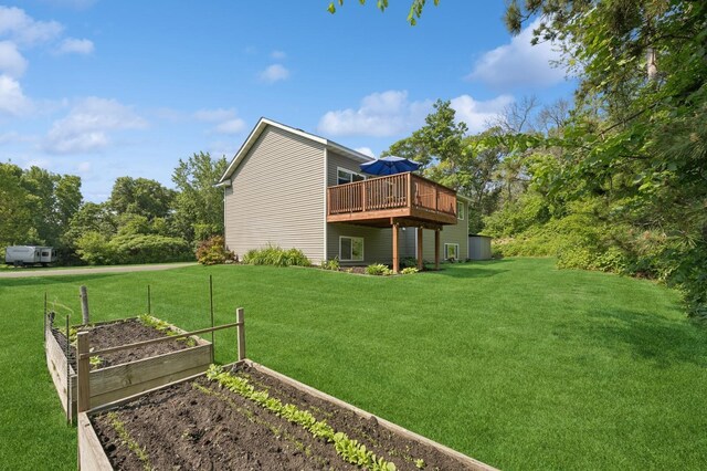 13362 Jefferson St, Becker, MN 55308 - rear view of property featuring a vegetable garden, a yard, and a deck