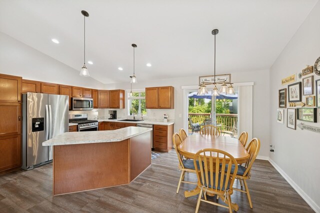 13362 Jefferson St, Becker, MN 55308 - kitchen with stainless steel appliances, a sink, dark wood-style flooring, backsplash, and lofted ceiling