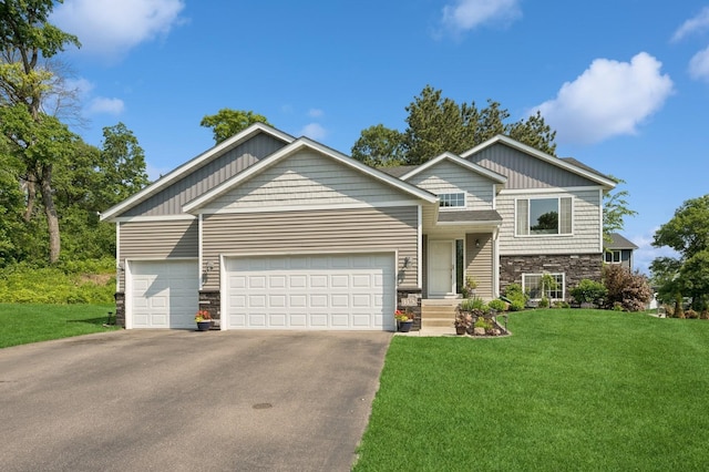 13362 Jefferson St, Becker, MN 55308 - tri-level home featuring stone siding, asphalt driveway, an attached garage, and a front lawn