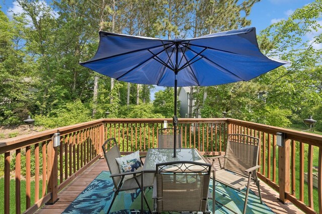 13362 Jefferson St, Becker, MN 55308 - wooden terrace with outdoor dining space