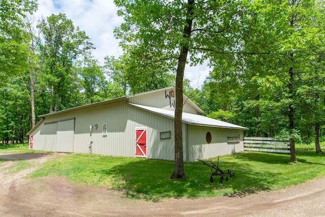 19214 County Road 12, Irondale Twp, MN 56455 - view of side of property with an outbuilding