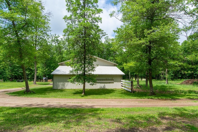 19214 County Road 12, Irondale Twp, MN 56455 - view of home's exterior with a lawn, an outbuilding, and an outdoor structure
