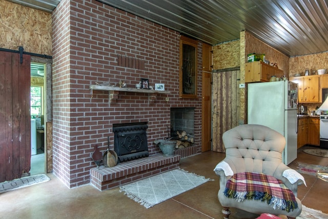 19214 County Road 12, Irondale Twp, MN 56455 - living room with a fireplace, a barn door, wood ceiling, and wood walls