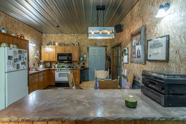 19214 County Road 12, Irondale Twp, MN 56455 - kitchen with white appliances, a peninsula, a sink, and brown cabinetry