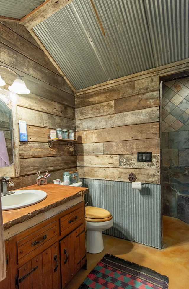 19214 County Road 12, Irondale Twp, MN 56455 - bathroom with wood walls, lofted ceiling, vanity, and toilet
