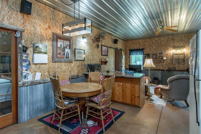 19214 County Road 12, Irondale Twp, MN 56455 - dining space with finished concrete floors and a ceiling fan