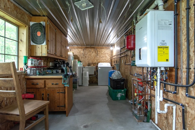 19214 County Road 12, Irondale Twp, MN 56455 - misc room with washer / clothes dryer, water heater, concrete flooring, and a workshop area