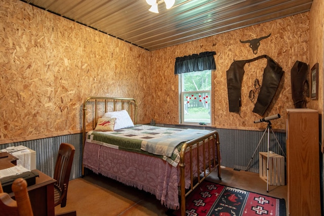 19214 County Road 12, Irondale Twp, MN 56455 - bedroom featuring wallpapered walls and wainscoting