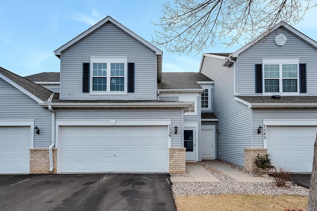 7539 Derby Ln, Shakopee, MN 55379 - traditional home with a garage, asphalt driveway, and a shingled roof