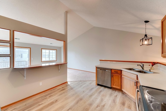 7539 Derby Ln, Shakopee, MN 55379 - kitchen featuring appliances with stainless steel finishes, a sink, lofted ceiling, a peninsula, and light wood finished floors