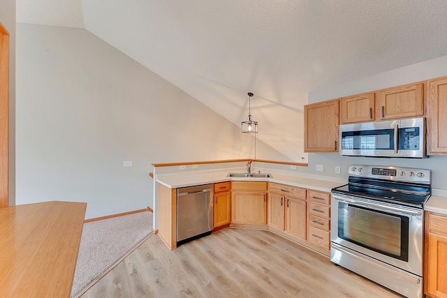 7539 Derby Ln, Shakopee, MN 55379 - kitchen featuring stainless steel appliances, a sink, vaulted ceiling, light wood-style flooring, and light countertops