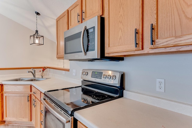 7539 Derby Ln, Shakopee, MN 55379 - kitchen featuring appliances with stainless steel finishes, a sink, light brown cabinetry, light countertops, and lofted ceiling