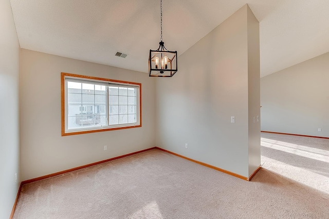 7539 Derby Ln, Shakopee, MN 55379 - empty room featuring a chandelier, carpet floors, baseboards, and lofted ceiling