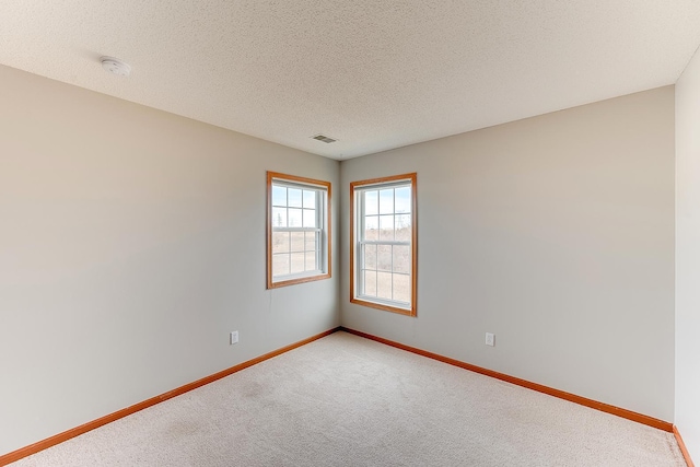 7539 Derby Ln, Shakopee, MN 55379 - empty room featuring baseboards, light carpet, a smoke detector, and a textured ceiling