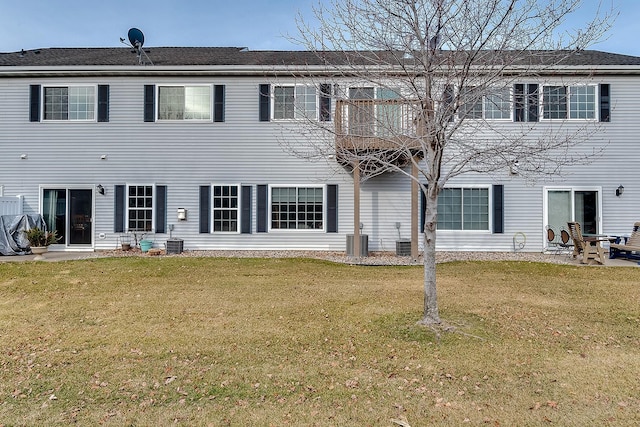 7539 Derby Ln, Shakopee, MN 55379 - back of house with a yard and central air condition unit