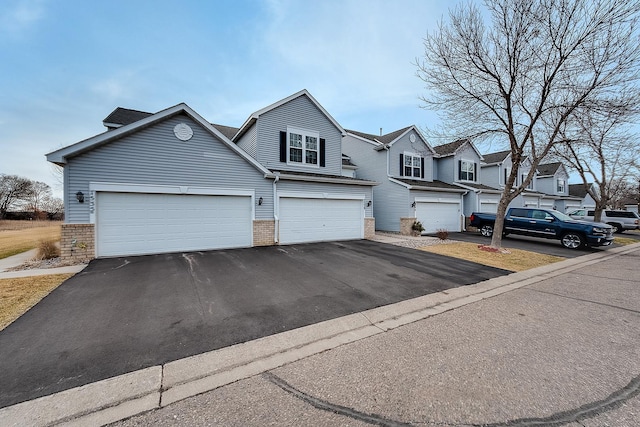 7539 Derby Ln, Shakopee, MN 55379 - townhome / multi-family property with asphalt driveway and brick siding