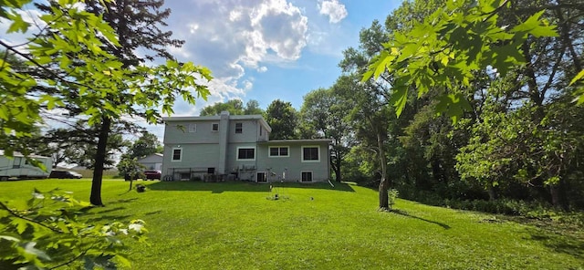 17548 749th Ave, Albert Lea Twp, MN 56007 - back of property featuring a yard, a chimney, and central air condition unit