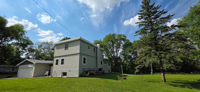 17548 749th Ave, Albert Lea Twp, MN 56007 - view of home's exterior featuring a chimney, a lawn, and a detached garage