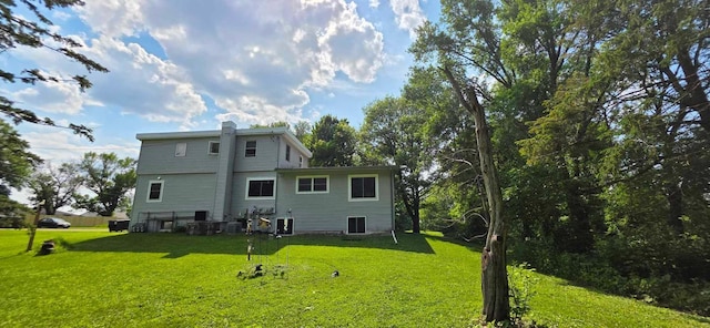 17548 749th Ave, Albert Lea Twp, MN 56007 - rear view of property with a yard and a chimney