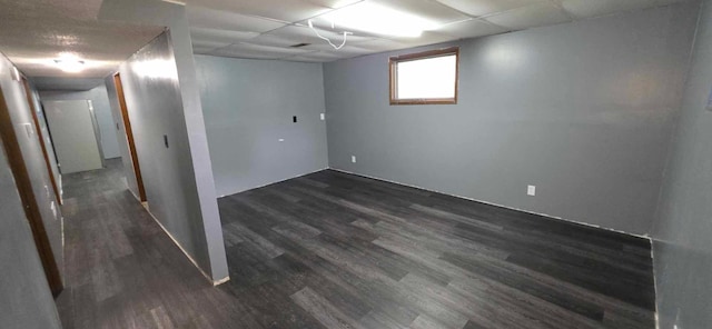 17548 749th Ave, Albert Lea Twp, MN 56007 - basement featuring dark wood finished floors and a paneled ceiling