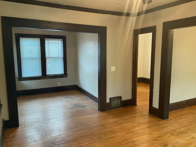 2430 Logan Ave N, Minneapolis, MN 55411 - unfurnished room featuring wood finished floors and baseboards