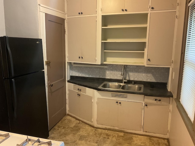 2430 Logan Ave N, Minneapolis, MN 55411 - kitchen with freestanding refrigerator, a sink, open shelves, and dark countertops