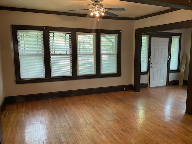 2430 Logan Ave N, Minneapolis, MN 55411 - unfurnished room with a ceiling fan, light wood finished floors, and baseboards