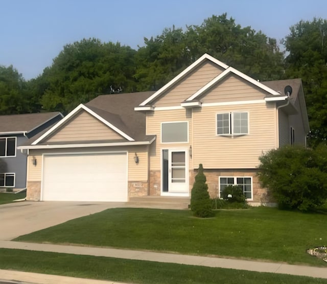 3657 46th Ave NW, Rochester, MN 55901 - view of front of property with an attached garage, concrete driveway, and a front yard