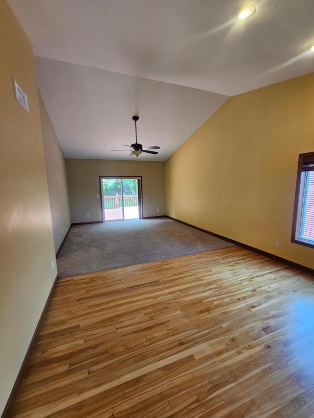 3657 46th Ave NW, Rochester, MN 55901 - unfurnished room with lofted ceiling, wood finished floors, baseboards, and a ceiling fan