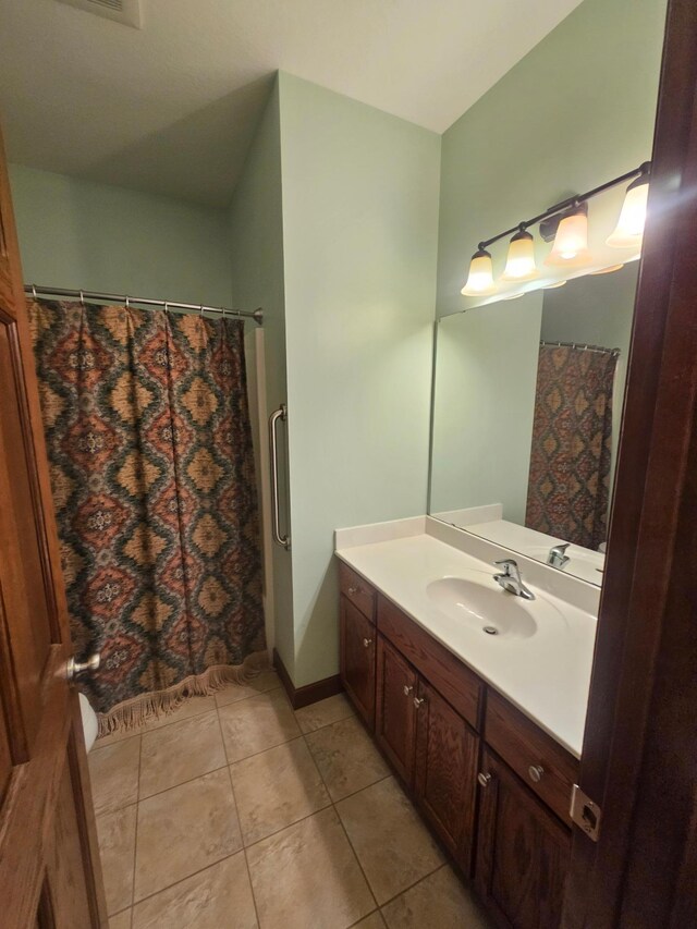 3657 46th Ave NW, Rochester, MN 55901 - bathroom with vanity, tile patterned floors, and curtained shower