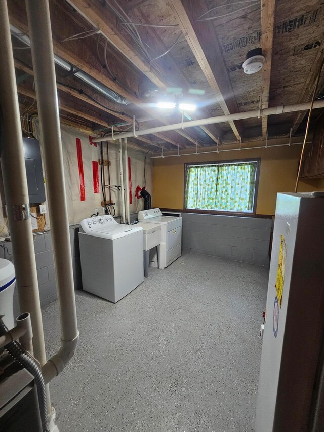 3657 46th Ave NW, Rochester, MN 55901 - below grade area featuring freestanding refrigerator, washing machine and clothes dryer, concrete block wall, and electric panel