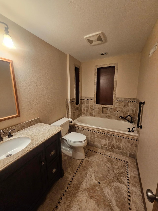 3657 46th Ave NW, Rochester, MN 55901 - bathroom featuring a garden tub, toilet, vanity, tile patterned floors, and a textured ceiling