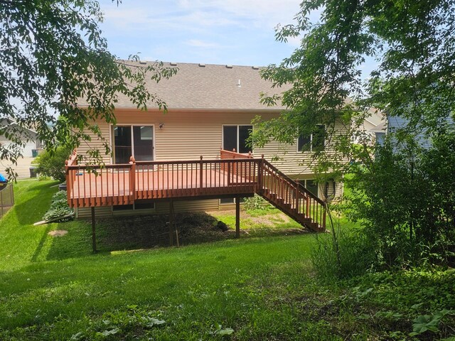 3657 46th Ave NW, Rochester, MN 55901 - rear view of property with a wooden deck, a yard, roof with shingles, and stairway