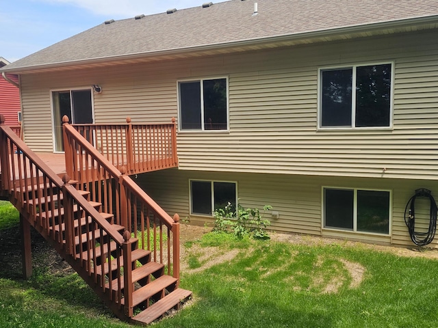3657 46th Ave NW, Rochester, MN 55901 - rear view of house with a wooden deck, a lawn, stairs, and roof with shingles