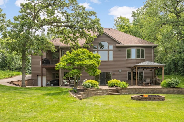 18510 Pheasant Ridge Rd, Credit River Twp, MN 55372 - back of house featuring a fire pit, a gazebo, a patio, a yard, and roof with shingles