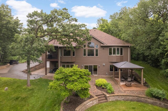 18510 Pheasant Ridge Rd, Credit River Twp, MN 55372 - back of property featuring a gazebo, a patio, and a lawn