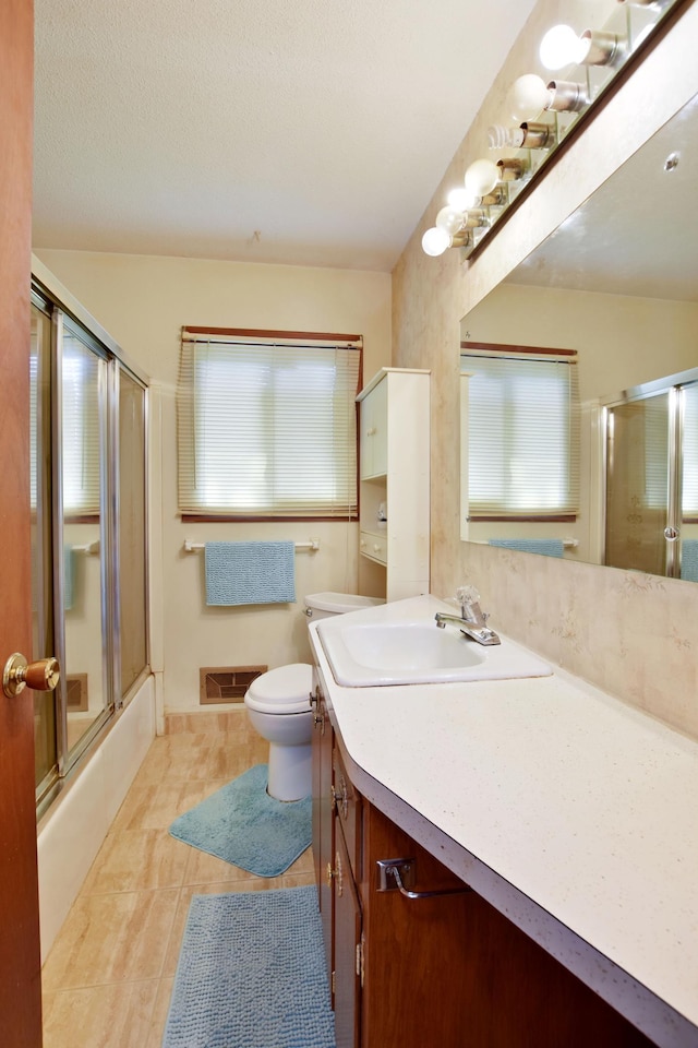 4035 Beryl Rd, Eagan, MN 55122 - full bathroom featuring vanity, toilet, combined bath / shower with glass door, and plenty of natural light