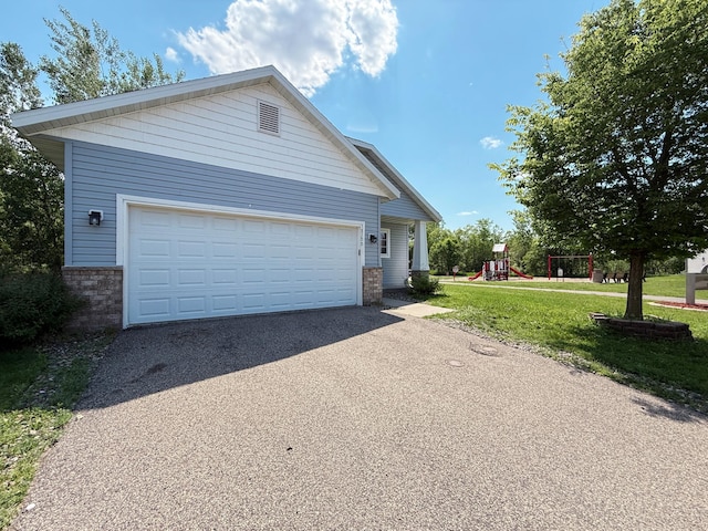 3100 212th St W, Farmington, MN 55024 - view of front of house featuring brick siding, a garage, a playground, a front yard, and driveway