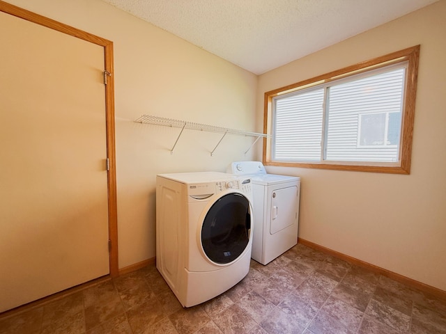 3100 212th St W, Farmington, MN 55024 - laundry area featuring washer and dryer, baseboards, and a textured ceiling
