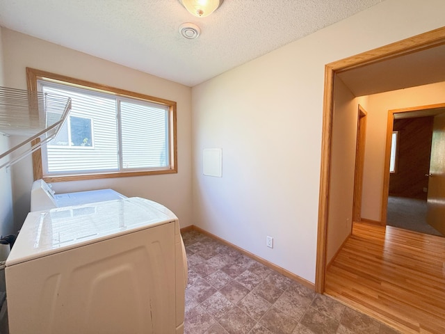 3100 212th St W, Farmington, MN 55024 - laundry area with independent washer and dryer, baseboards, and a textured ceiling