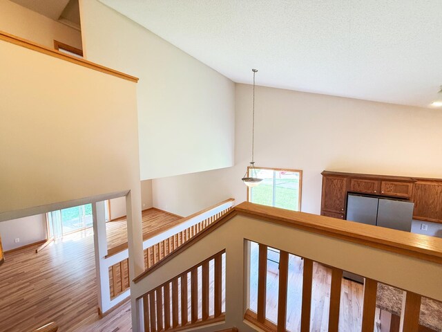 3100 212th St W, Farmington, MN 55024 - stairs with healthy amount of natural light, wood finished floors, and high vaulted ceiling