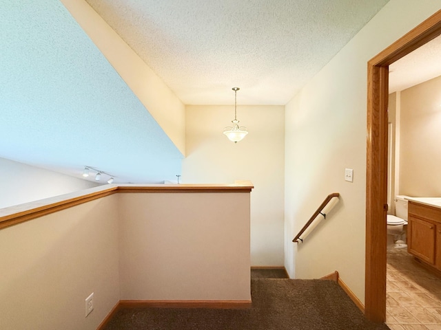 3100 212th St W, Farmington, MN 55024 - stairs with a textured ceiling, baseboards, and carpet flooring