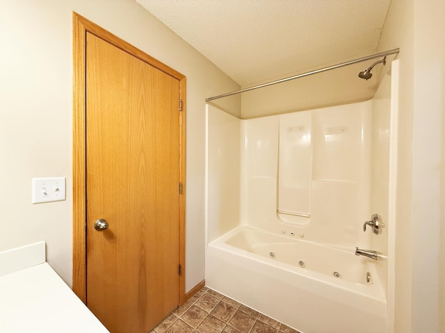3100 212th St W, Farmington, MN 55024 - bathroom featuring a combined bath / shower with jetted tub and a textured ceiling