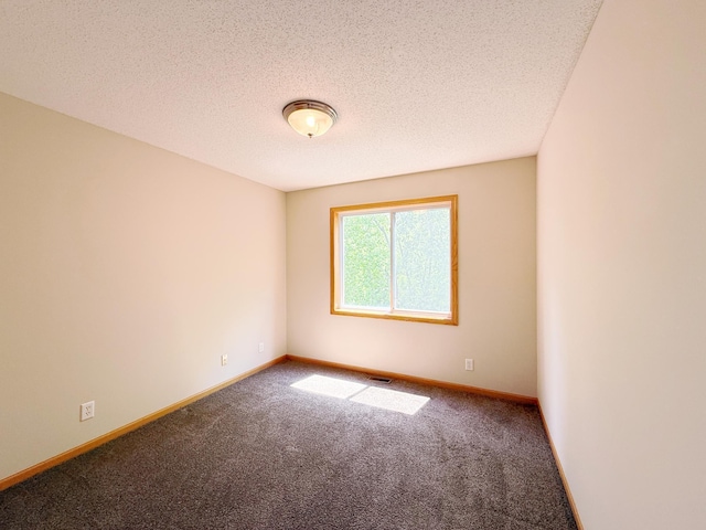 3100 212th St W, Farmington, MN 55024 - spare room featuring carpet flooring, baseboards, and a textured ceiling