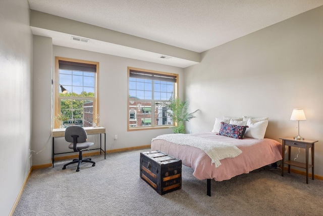 3310 Nicollet Ave Unit 302, Minneapolis, MN 55408 - bedroom with carpet flooring, baseboards, and a desk