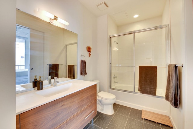 901 2nd St Unit 905, Minneapolis, MN 55415 - bathroom with vanity, toilet, shower / bath combination with glass door, and tile patterned flooring